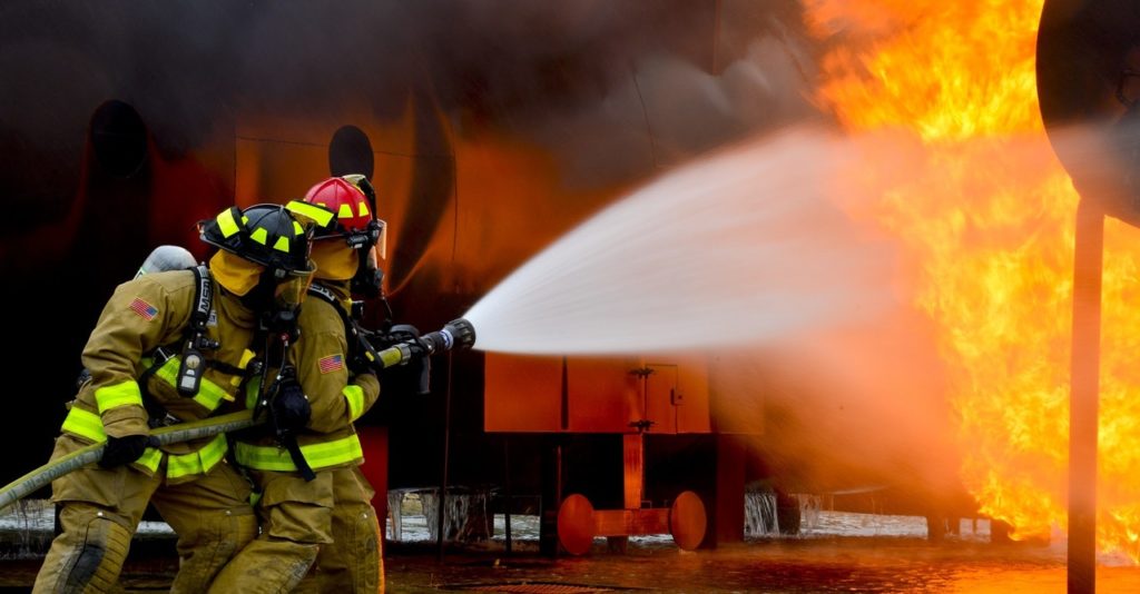 Firemen putting out fire. 