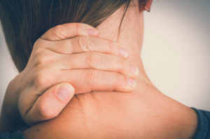 Woman with muscle injury having pain in her neck