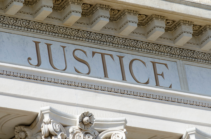 justice engraved on a courthouse