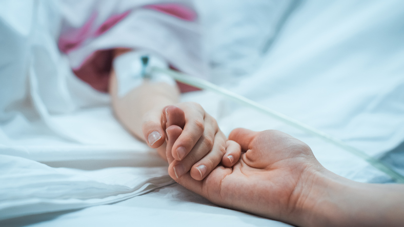 Little Child Lying in the Hospital Bed