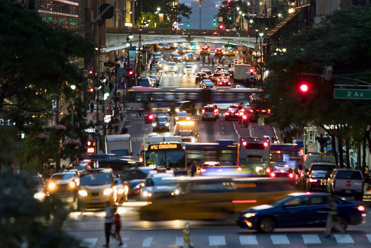 42nd Street is crowded with the busy night lights of crosstown traffic through Midtown Manhattan in New York City NYC