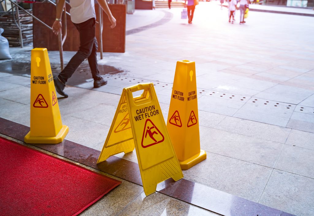 Wet floor sign at a building entrance