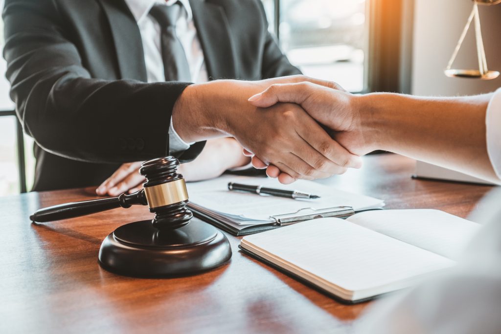 Two men shaking hands after a deal