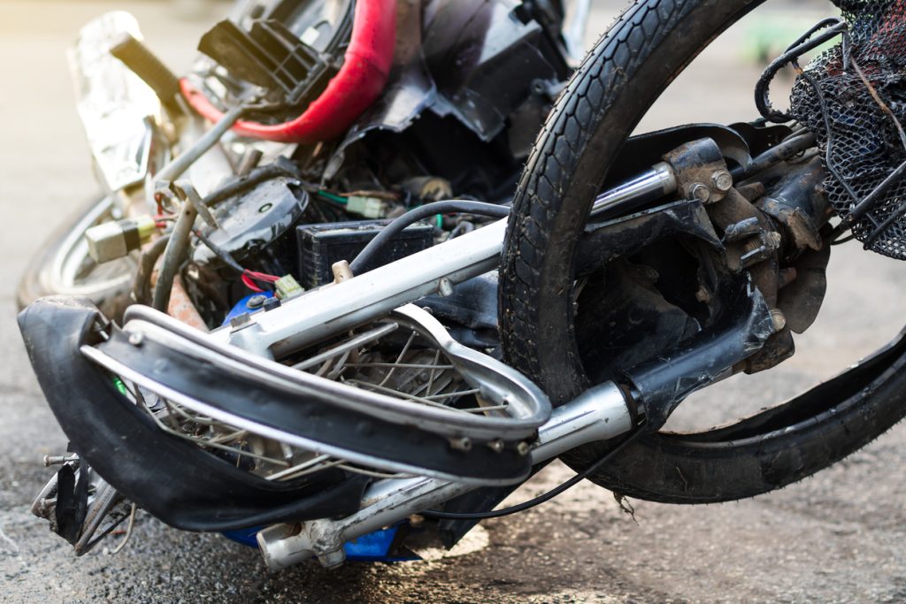 A close up image of a crashed motorcycle