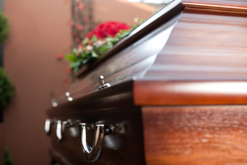 Close up view of casket with flowers