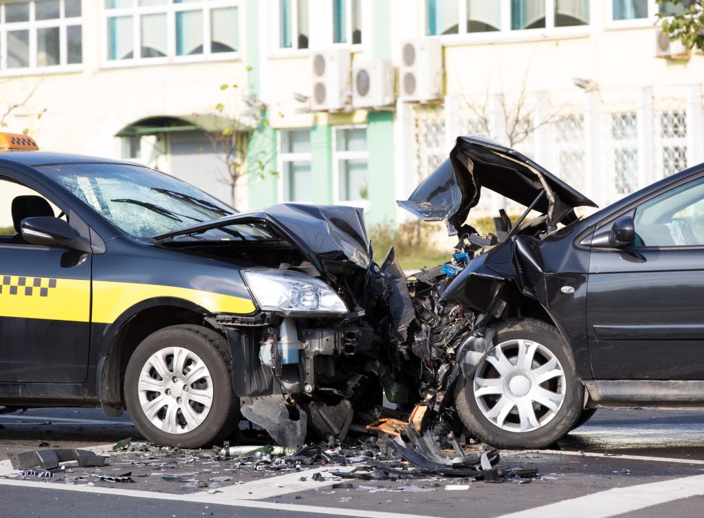 Two wrecked cars after a head-on collision